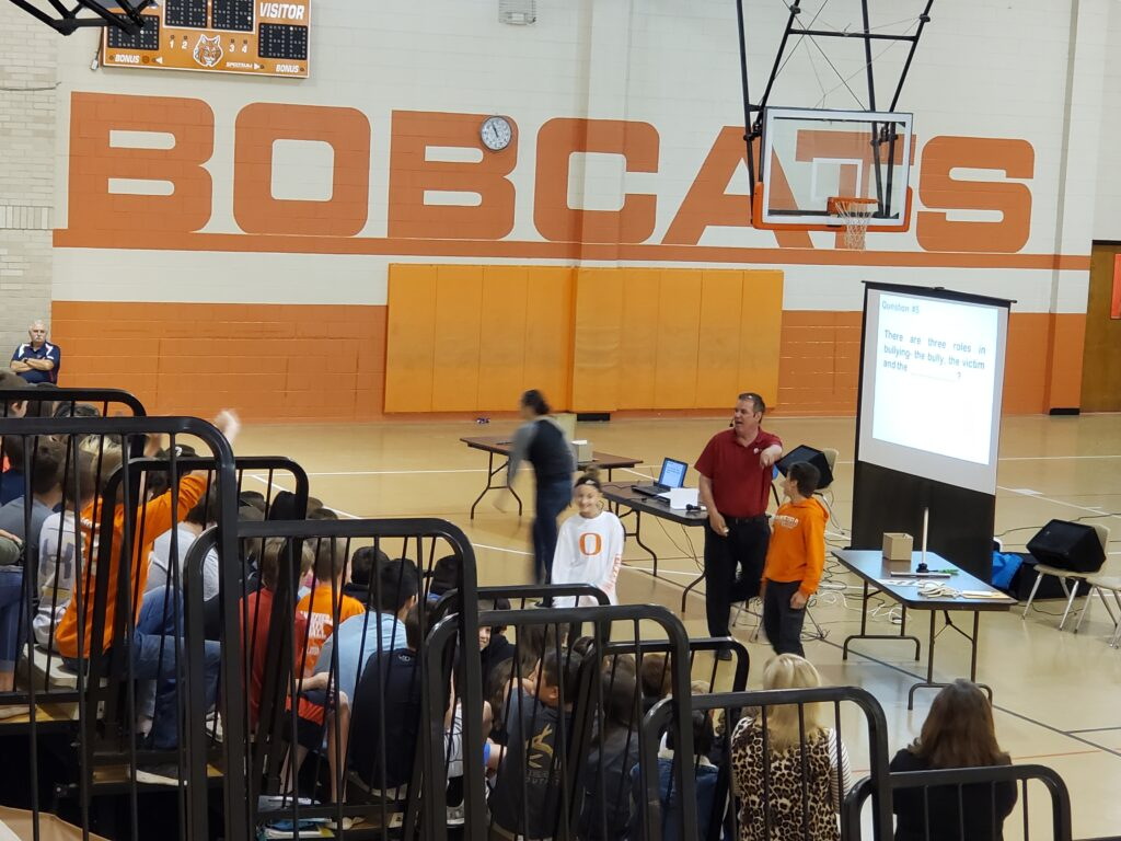 Jim Jordan speaking to middle school students at a gymnasium school assembly